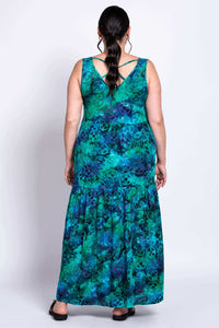 Back view of model wearing Kayana dress, featuring criss cross back detail
