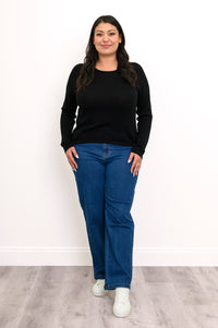 Front-facing view of a women's relaxed-fit dark knit top with a flat finished hemline, standing on white background.