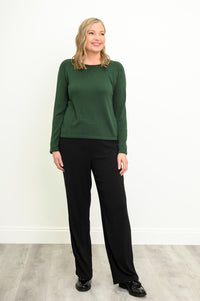 Front view of a vibrant deep moss pullover and slim black pants, highlighting a comfortable, relaxed drape.