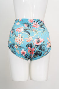 Teal tropical print high rise brief underwear shown on a white display mannequin against a plain backdrop.