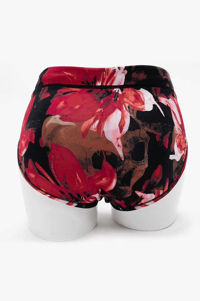 Back view of La Gaunche Brief featuring vivid skull and red floral design on mannequin