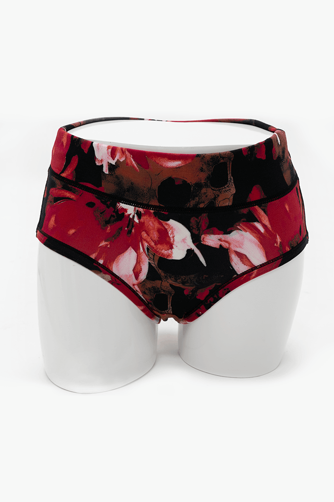 Front view of La Gaunche Brief in crimson floral skull print on mannequin