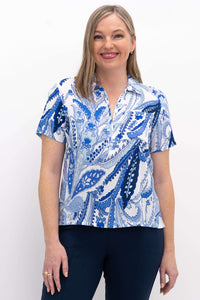 Model wearing a blue paisley short sleeve Lala top with zip front and collar