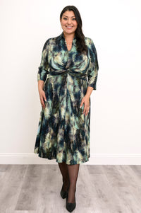 Flowy bamboo A-line dress featuring a shirt collar, V-neck, and defined high waist twist, shown in a front view.