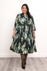 A-line watercolor tree pattern bamboo dress featuring a front twist, collar, and 3/4 sleeves, styled with heels.