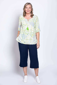 Woman posing in Luna Boho Peasant Top with tie-front detail and flowy sleeves