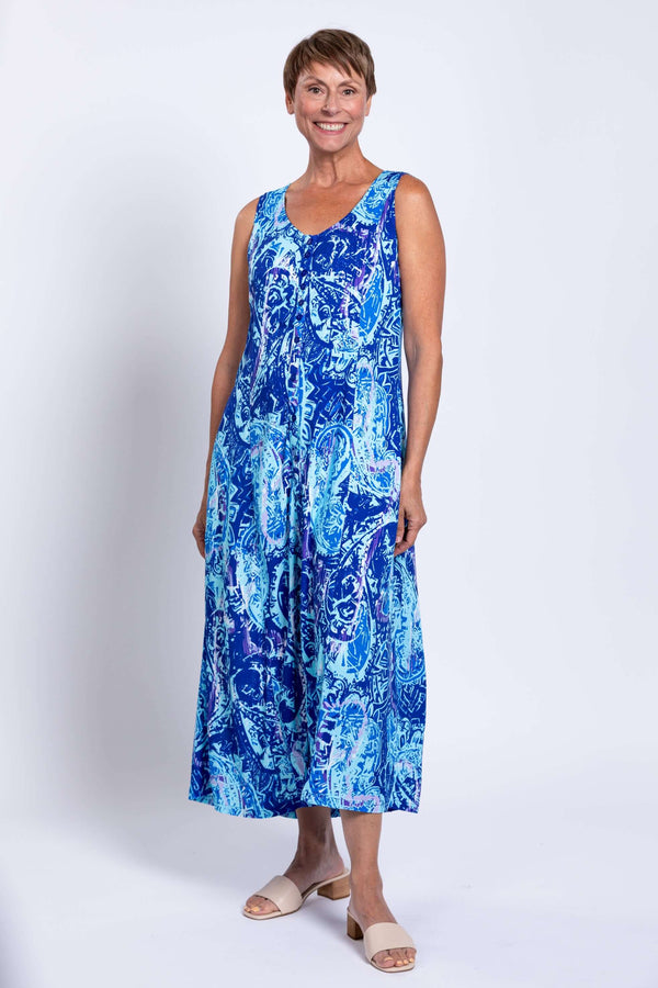 Woman wearing Madison sleeveless blue printed maxi dress with scoop neckline