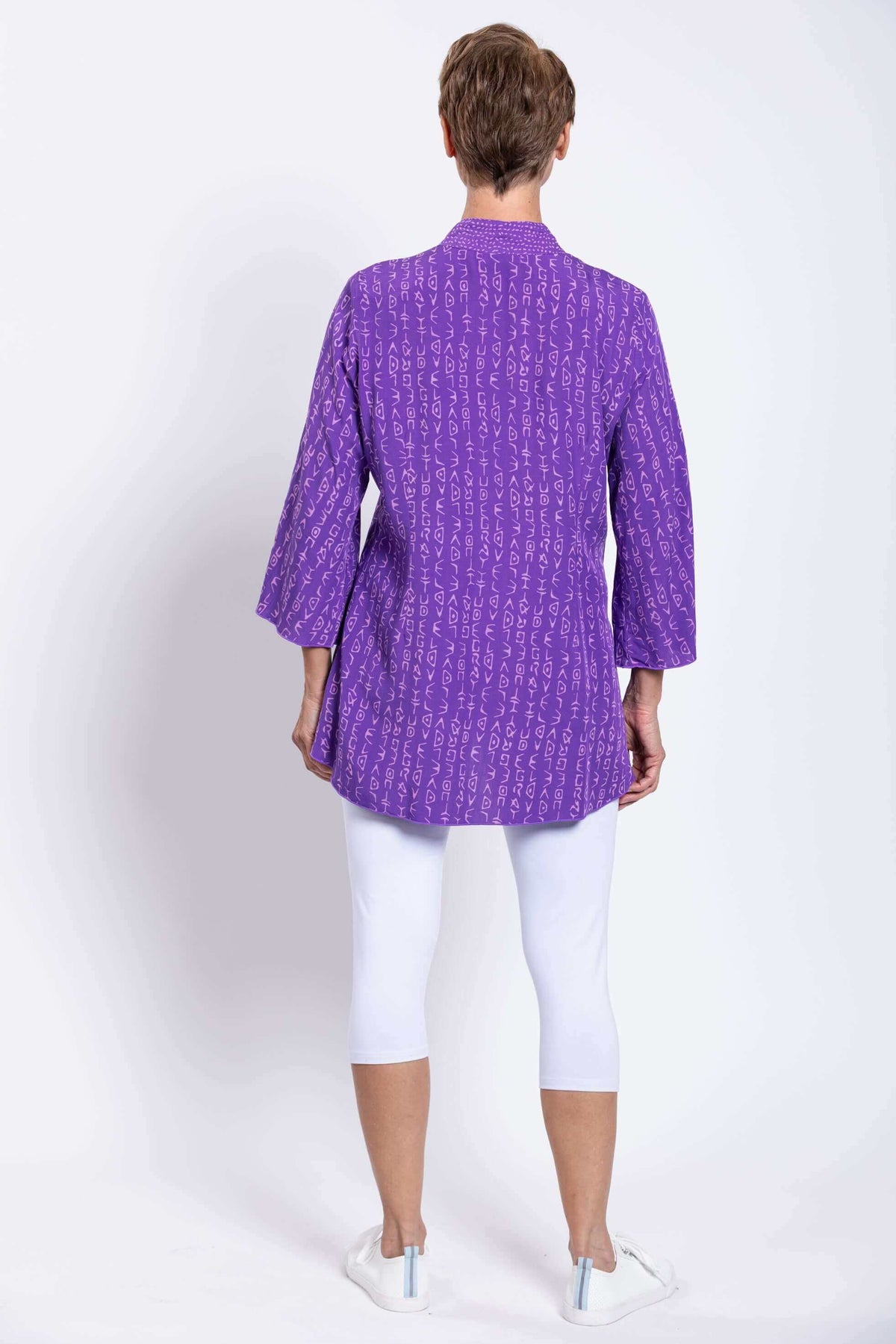 Back view of purple Mar blouse showing pattern and relaxed fit