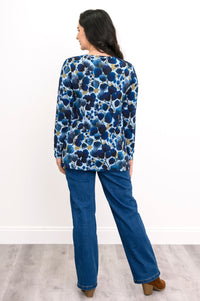 Rear view of an indigo patterned long sleeve tunic blouse with a straight-cut hemline.