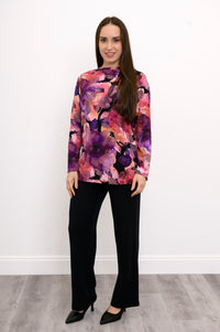 Profile shot of a women's pink floral print bamboo-cotton tunic, showcasing a body-skimming and fluid drape.