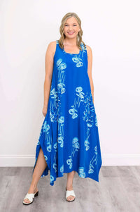 Front view of woman wearing Maria Dress in blue with white botanical print