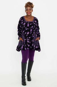 Full outfit view of Maria Tunic with violet rose print, paired with purple leggings and black boots