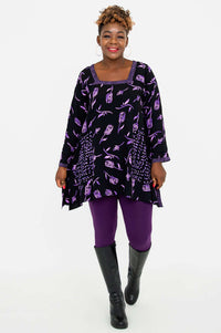 Woman walking in Maria Tunic with violet rose print, front view