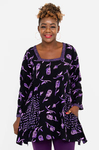 Front view of woman wearing Maria Tunic with violet rose print and square neckline