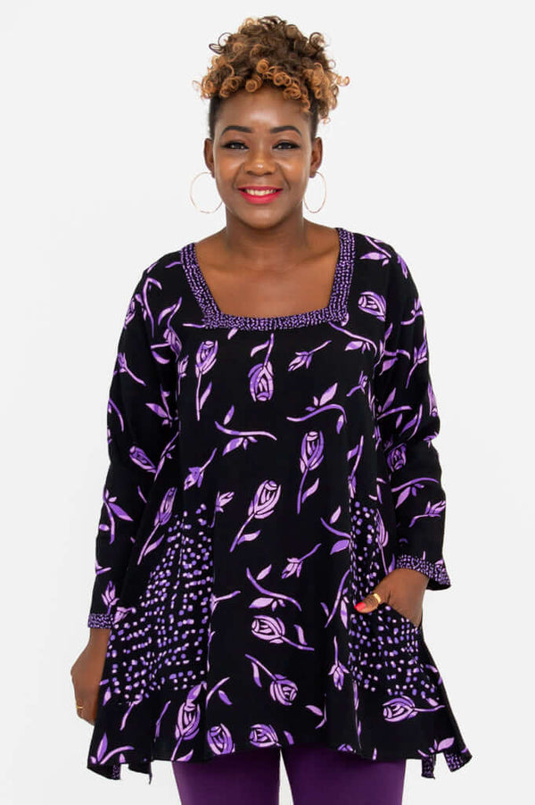Front view of woman wearing Maria Tunic with violet rose print and square neckline
