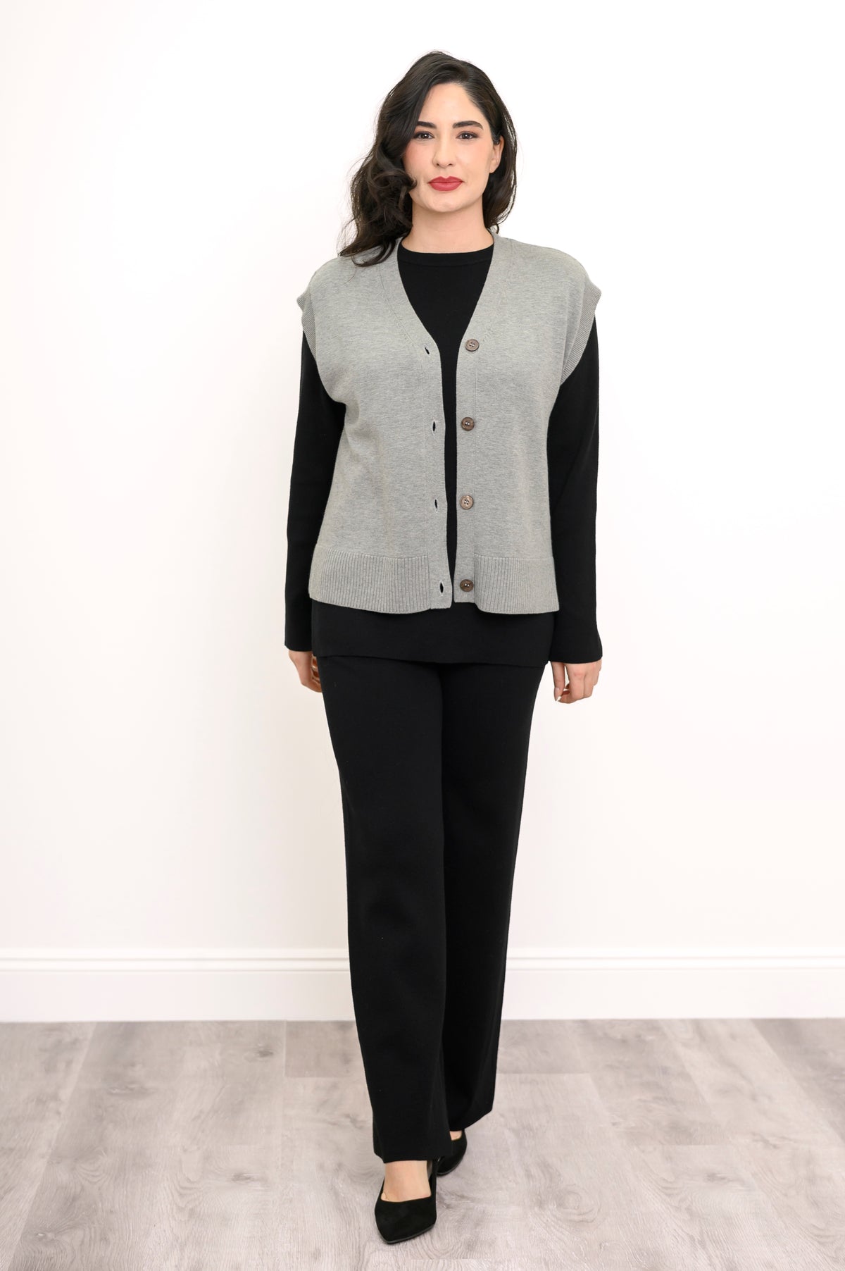 Front view of a women's gray cotton-blend knit layer with marled buttons, standing on a white background.