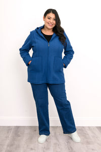 full body view of model in straight fit boiled wool jacket in cobalt blue