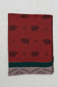 Folded maroon pashmina scarf with black elephant and floral patterns