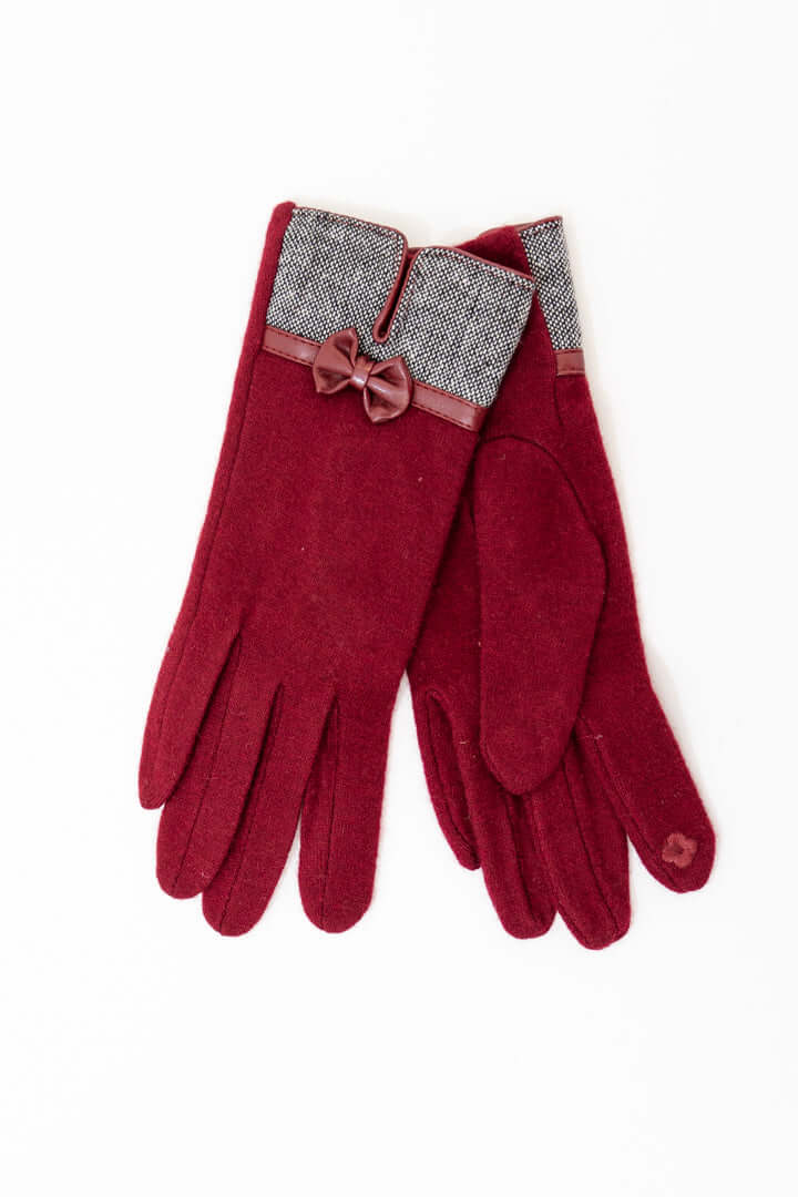 Pair of maroon wool gloves with tweed cuffs and a bow accent, displayed on a white background