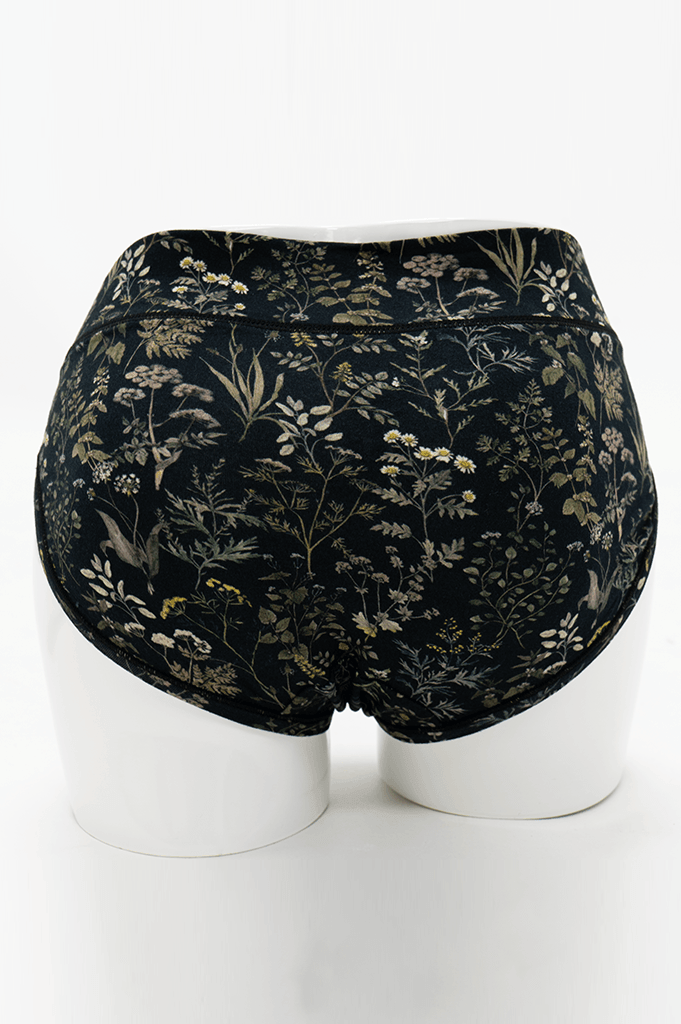 Back view of Meadow Black Hipster briefs featuring seamless design and botanical pattern