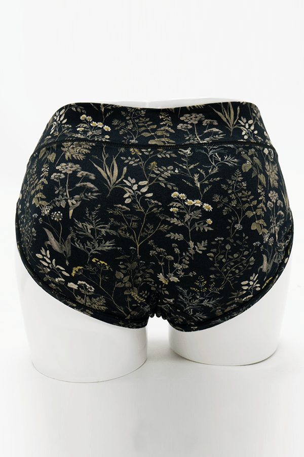 Back view of Meadow Black Hipster briefs featuring seamless design and botanical pattern