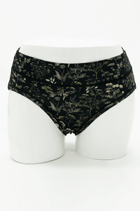 Front view of Meadow Black Hipster briefs with botanical print on mannequin