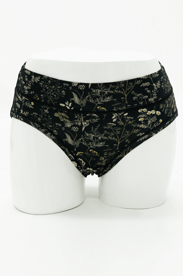 Front view of Meadow Black Hipster briefs with botanical print on mannequin