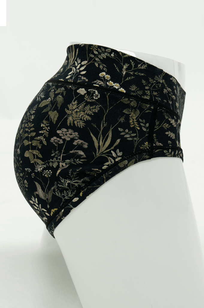 Side view of Meadow Black Hipster underwear highlighting floral print and fit