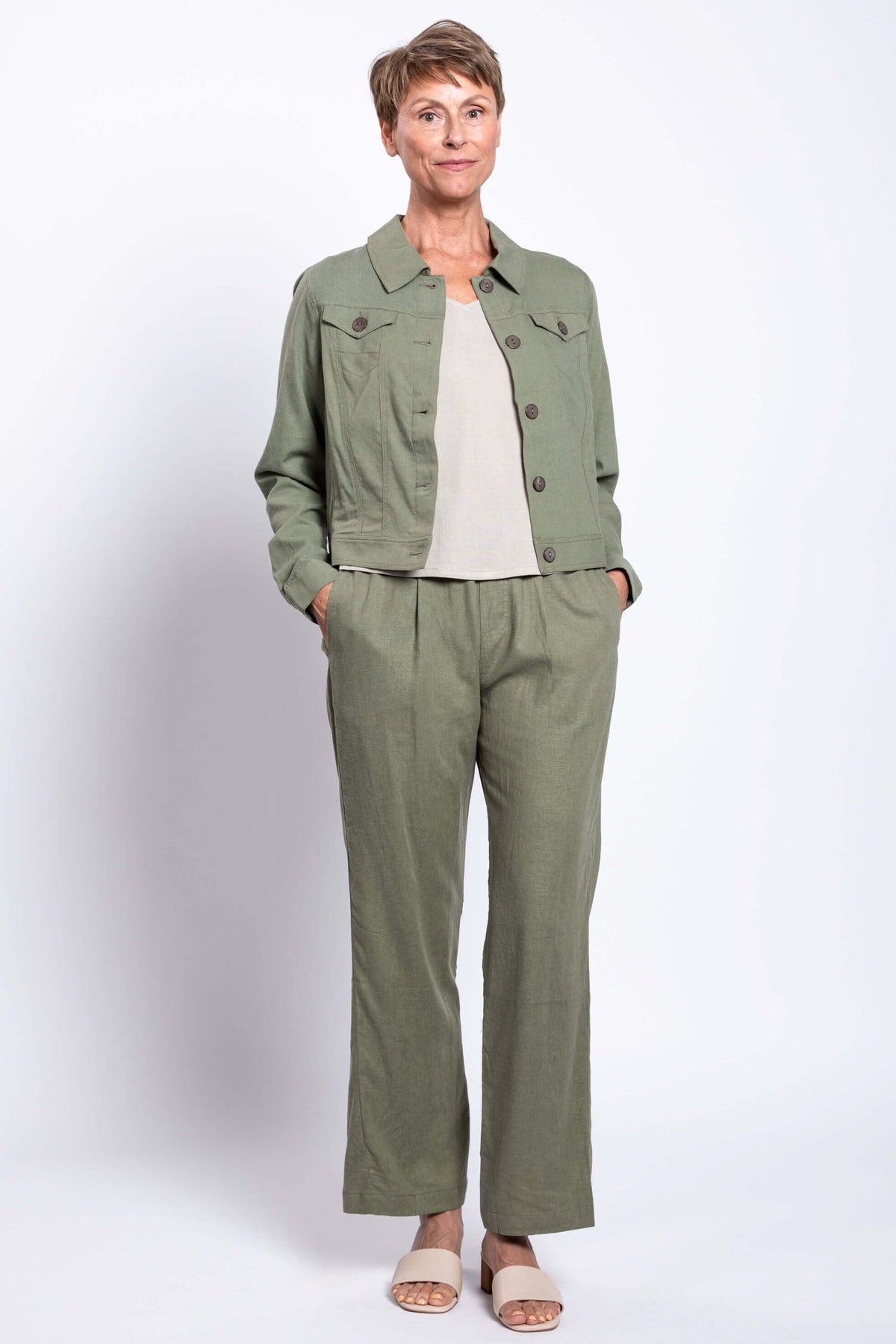 Full body view of Melodie Pant with matching jacket, light top, and sandals
