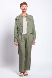 Full body shot of model in Melodie Pant and matching green jacket with beige sandals