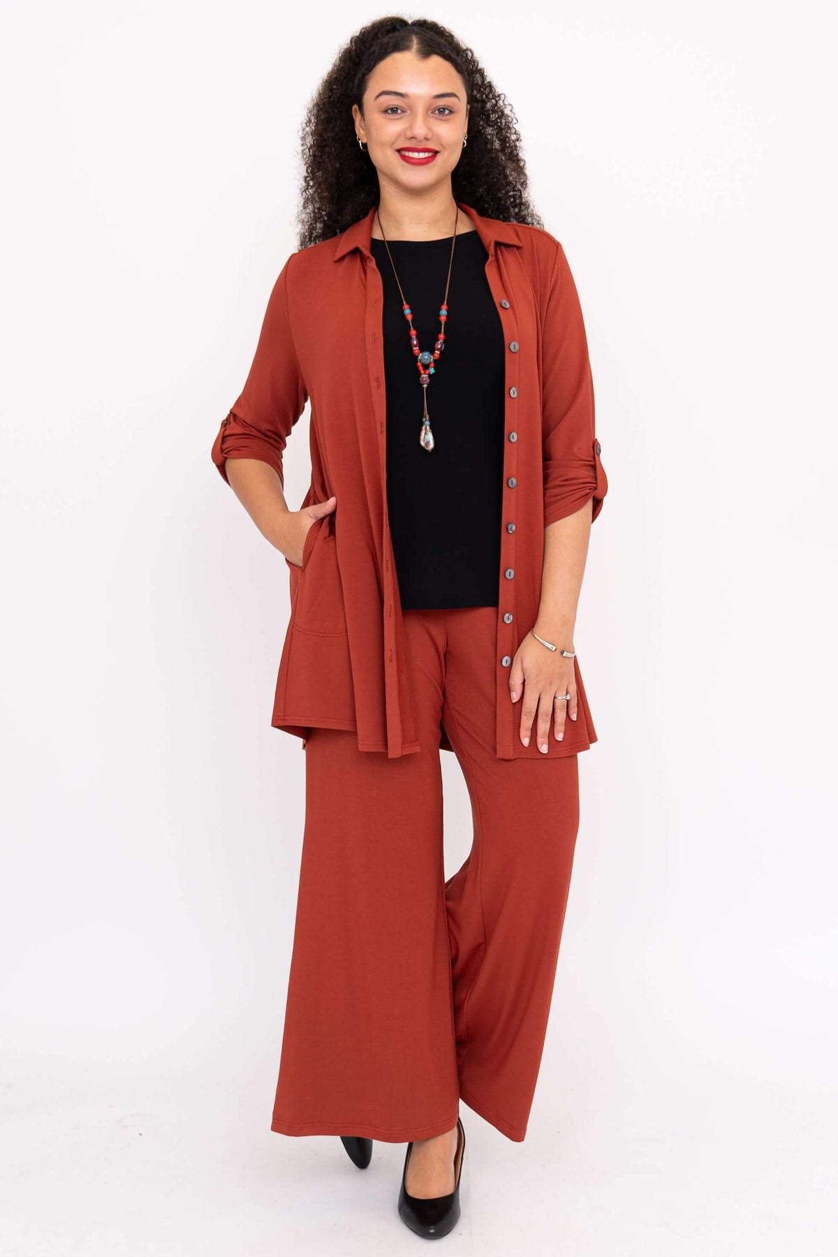 Woman styling Michele Bamboo French Terry blouse open, showcasing versatile outerwear