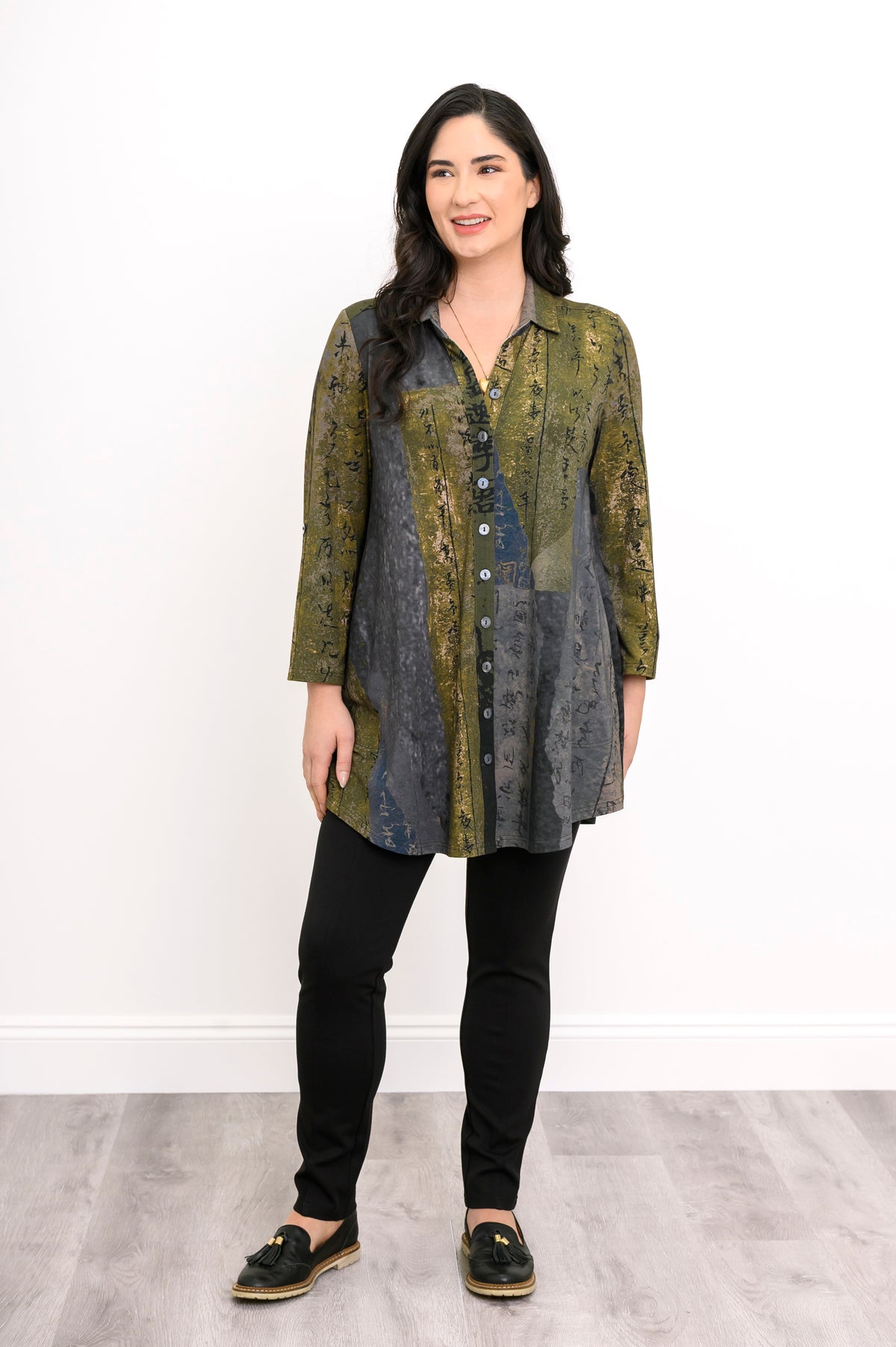Oversized long-sleeve green and grey patterned bamboo tunic with a shirt collar on a white background.