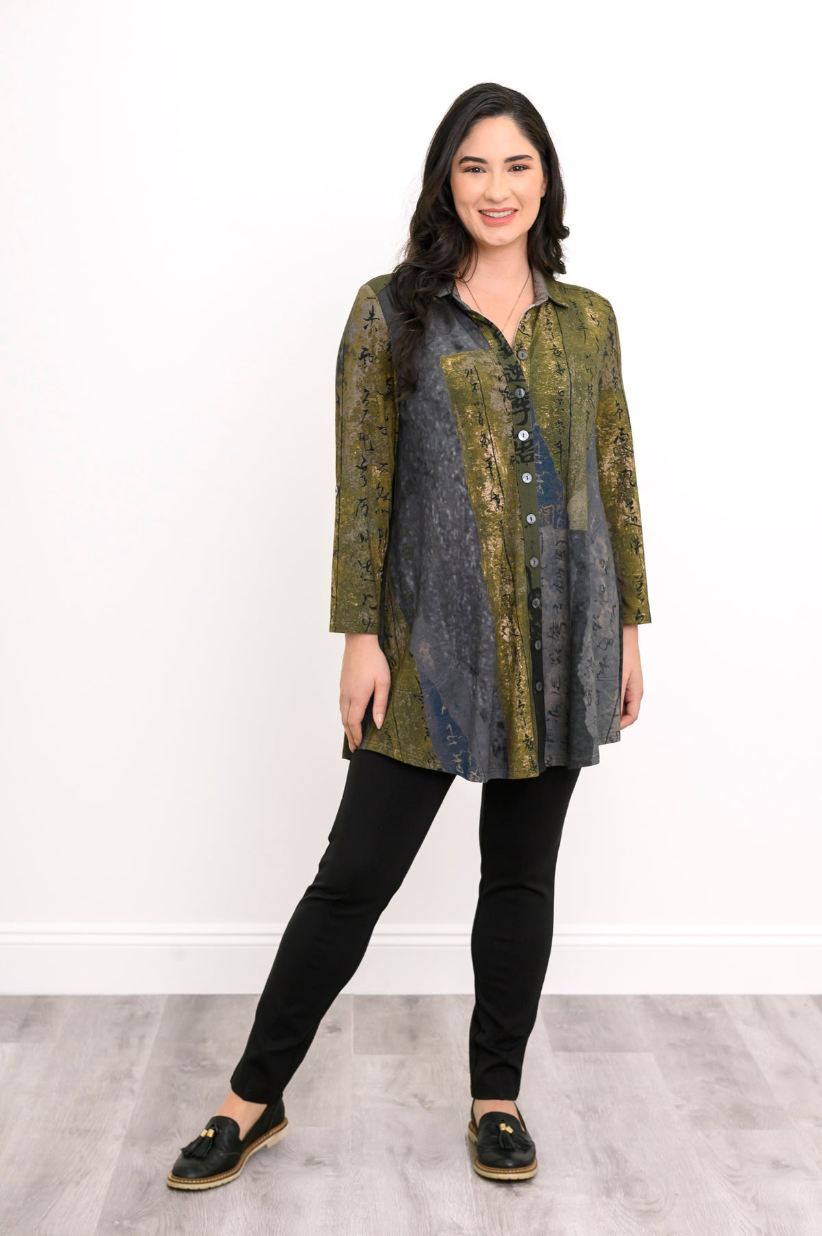 Relaxed-fit bamboo French terry blouse featuring a collar and long sleeves, paired with black trousers.