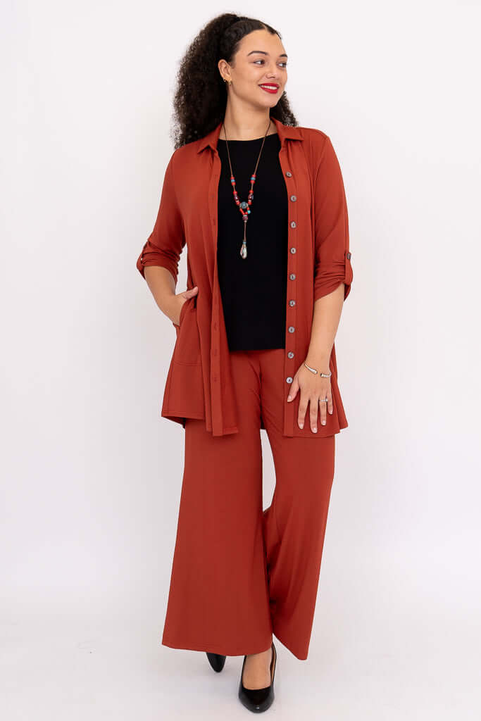 Model styling Michele Bamboo French Terry blouse open over a black top and necklace