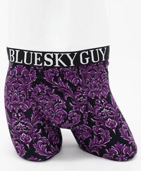 Front view of Middle Man bamboo boxer briefs featuring a purple baroque pattern and 'Blue Sky Guy' waistband