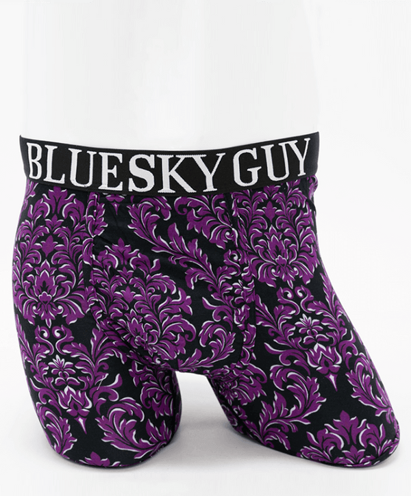 Front view of Middle Man bamboo boxer briefs featuring a purple baroque pattern and 'Blue Sky Guy' waistband