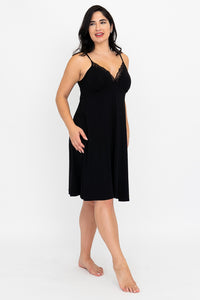 Front view of the black Mina Slip Dress with lace trim.