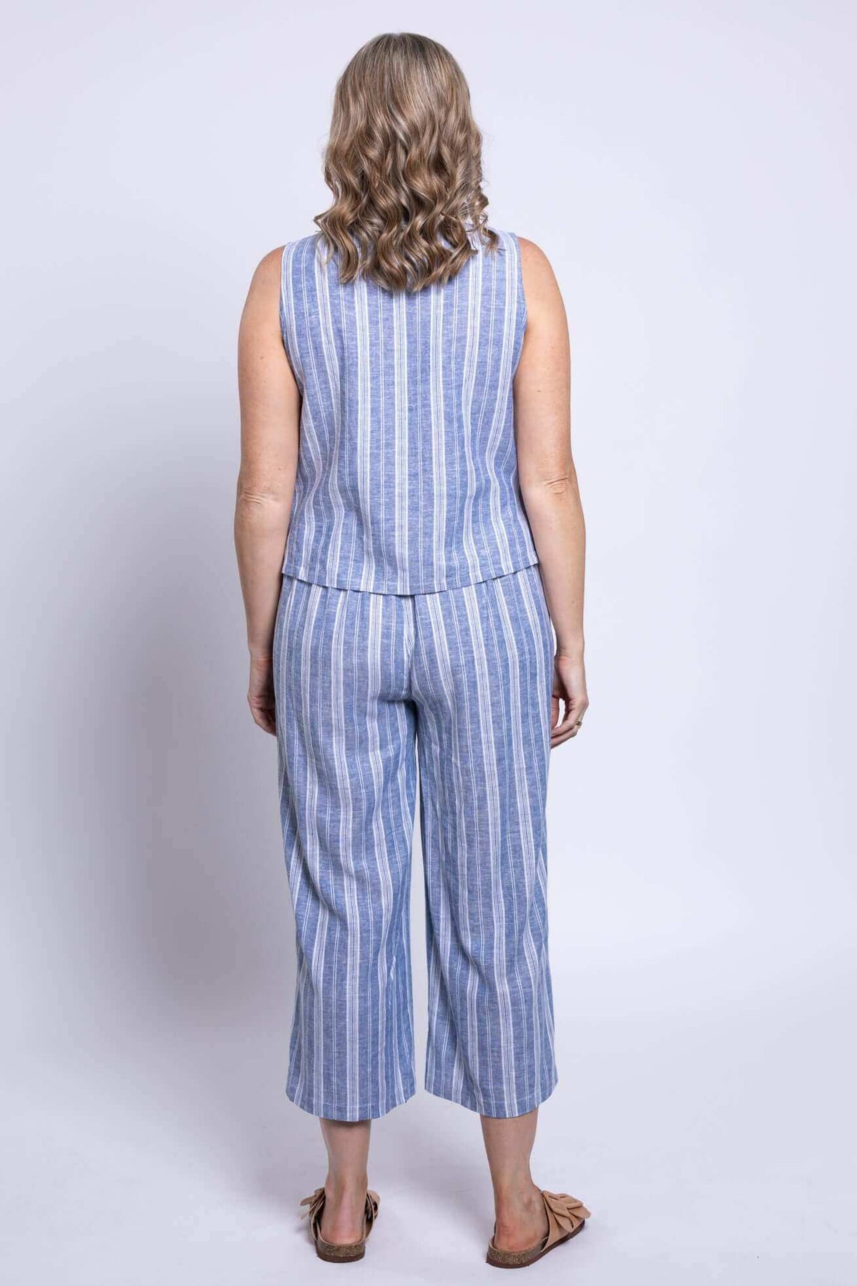 Model wearing Landon Capri Pants and matching top, back view