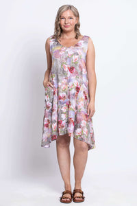 Model in sleeve-less Gia Dress showing uneven hem and dual pockets, standing front-facing