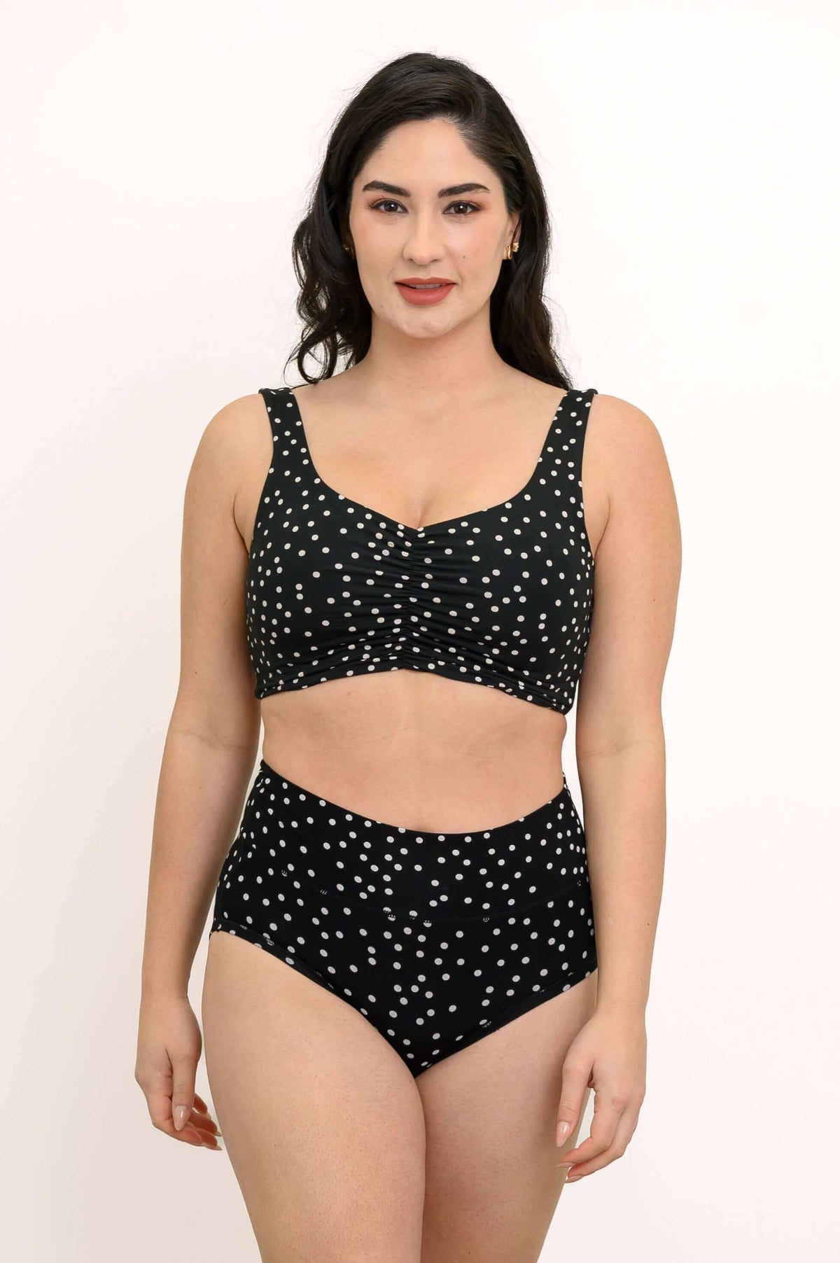 Model wearing black polka dot Clipper Top and matching high-waisted bottoms
