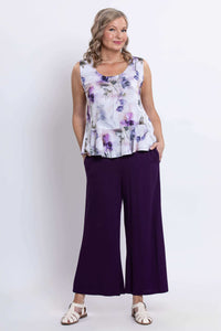 Model in Ginny Tank with purple floral pattern paired with wide-leg purple pants