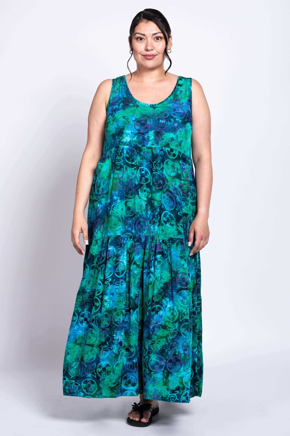 Model facing forward in the Kayana dress, showcasing its flowing, maxi length