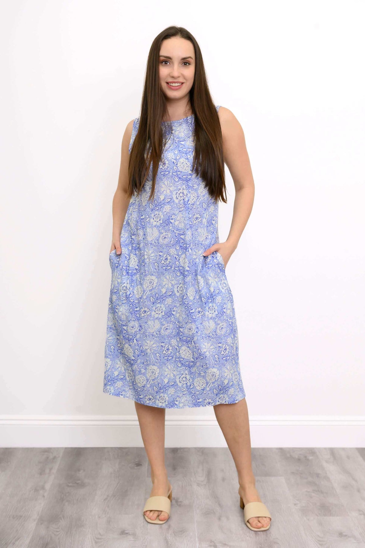 Model in Patricia Dress, hands in pockets, full front view