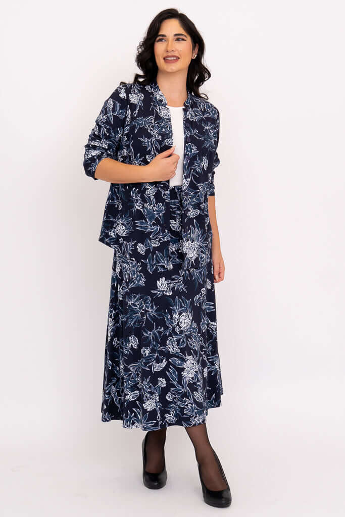 Model in coordinated navy floral skirt and open jacket set
