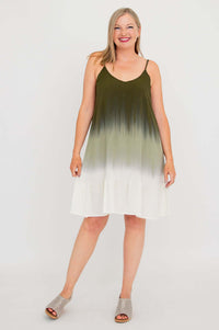 Woman modeling olive ombre mini dress, standing with legs apart, front view