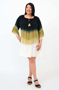 Model wearing an ombre black, olive, and white boho dress with ruffled sleeves
