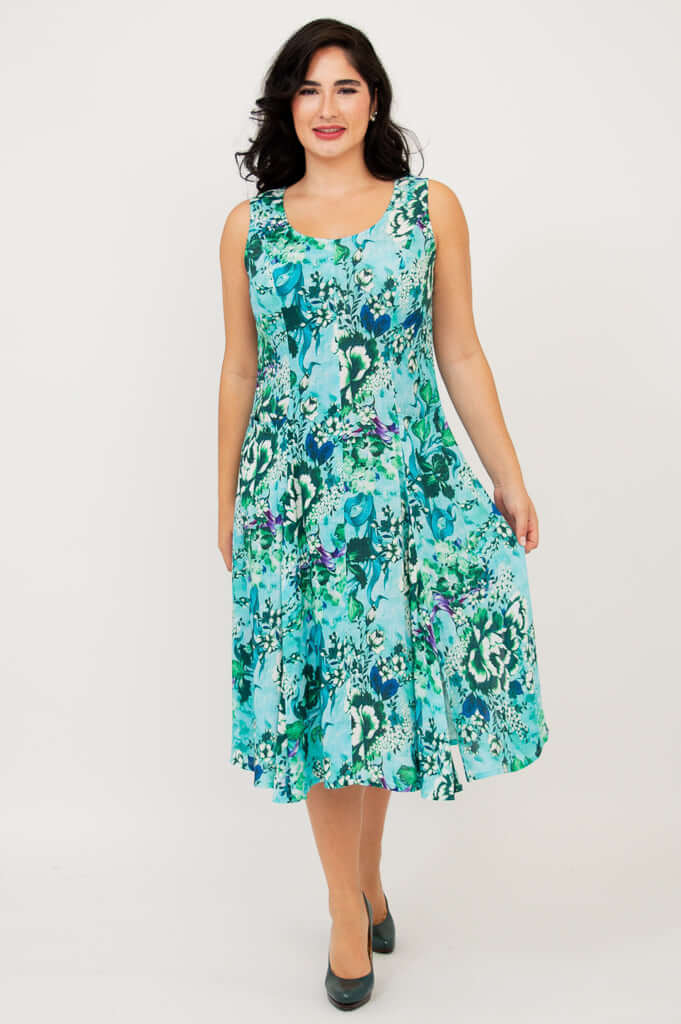 Model lifting skirt for movement in an aqua blue sleeveless A-line dress