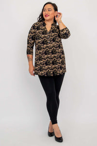 Model posing in Edwina Bamboo Top with hand touching ear