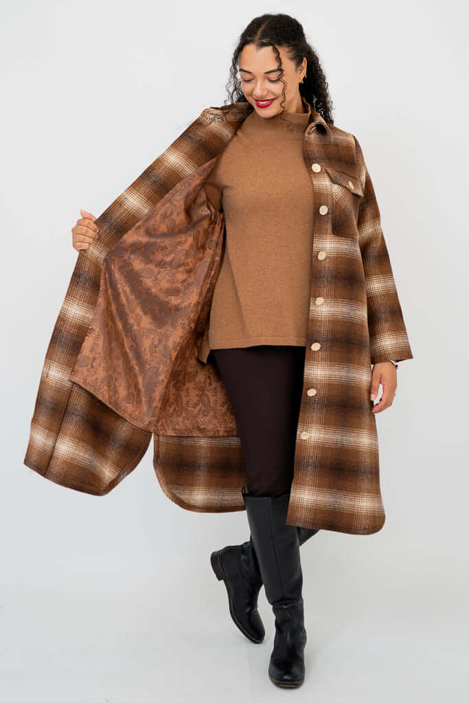 Model showing inside paisley lining of the brown plaid wool-blend coat
