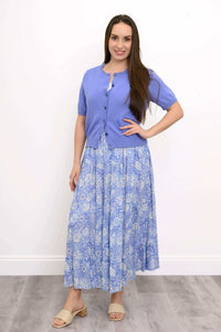 Woman modeling a blue floral tiered skirt with hand on hip